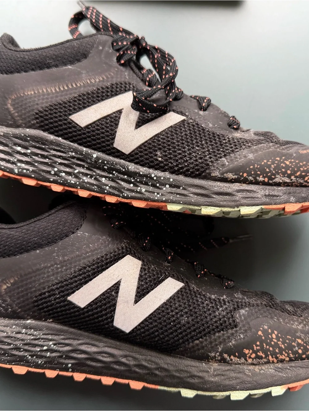 New Balance Kids Black Sneakers with orange/teal Accent